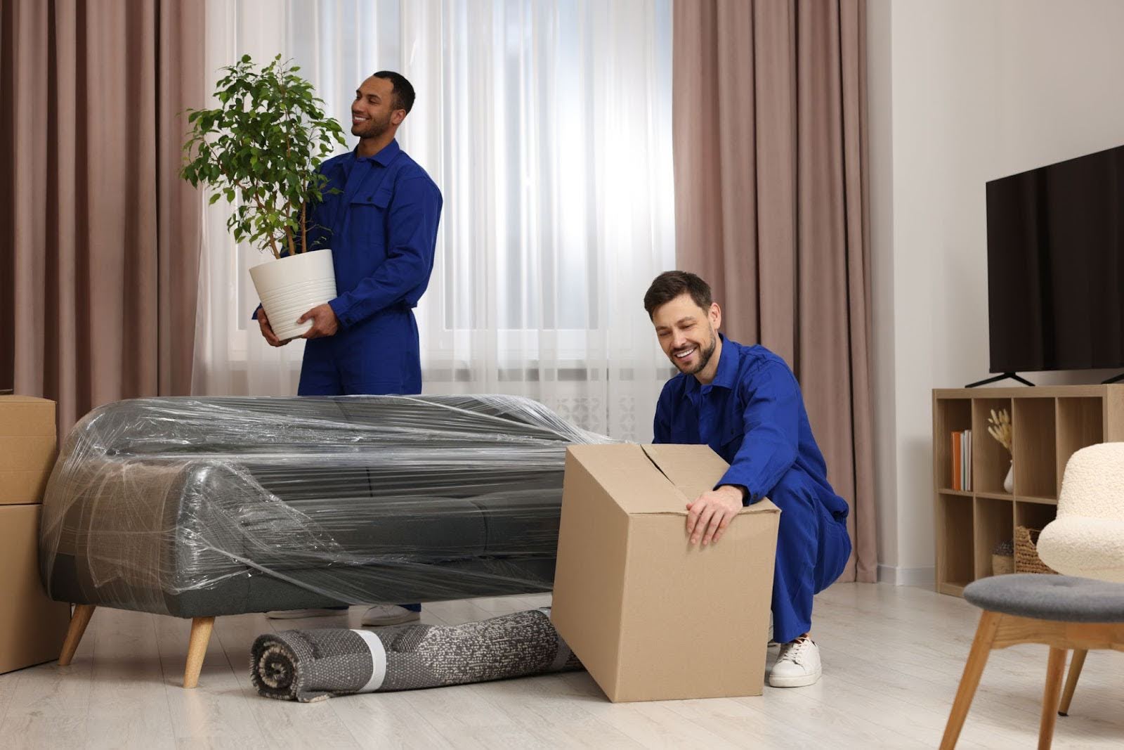 Professional interstate furniture removalists in Tasmania packing and moving the contents of a room